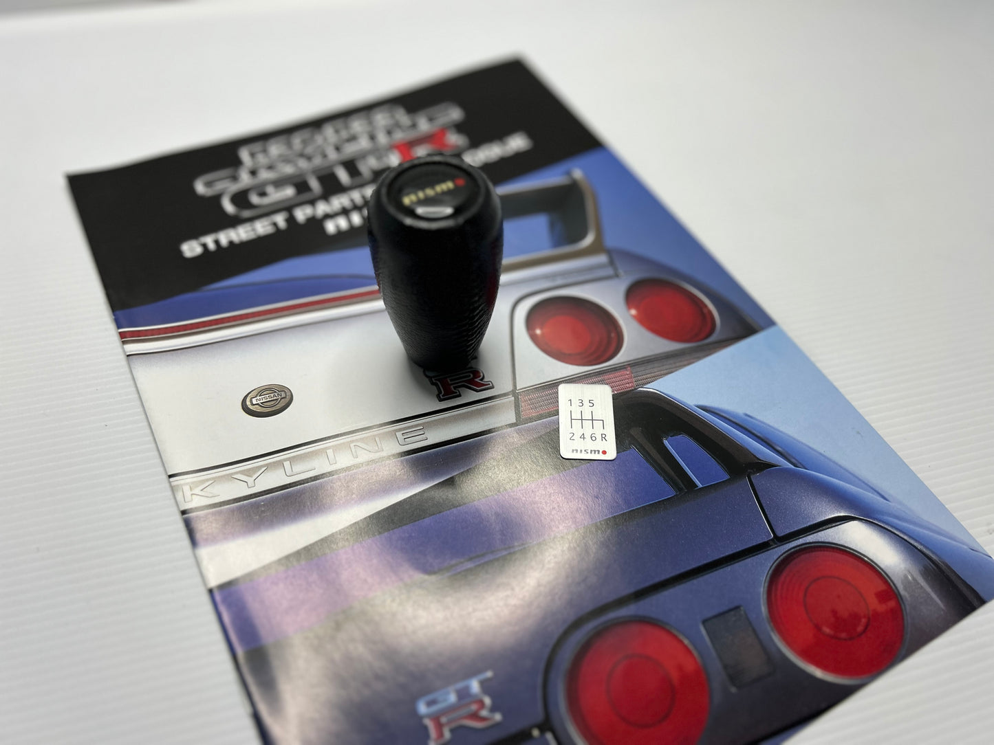 Nismo Mid Logo Shift Knob with shift Emblem - Black / Leather