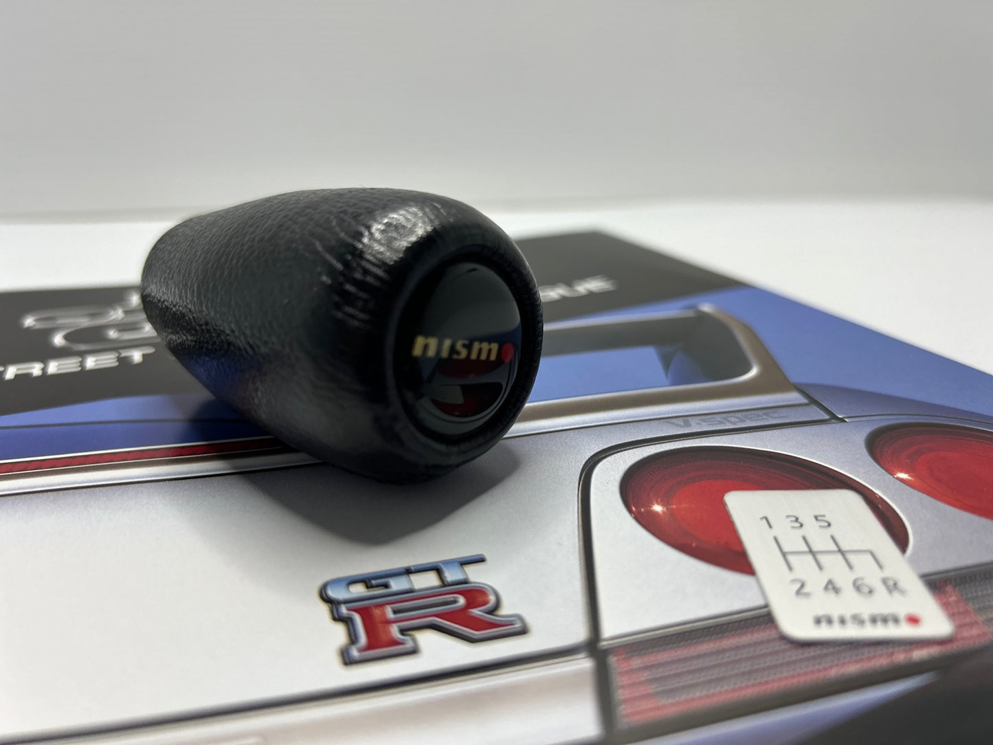 Nismo Mid Logo Shift Knob with shift Emblem - Black / Leather