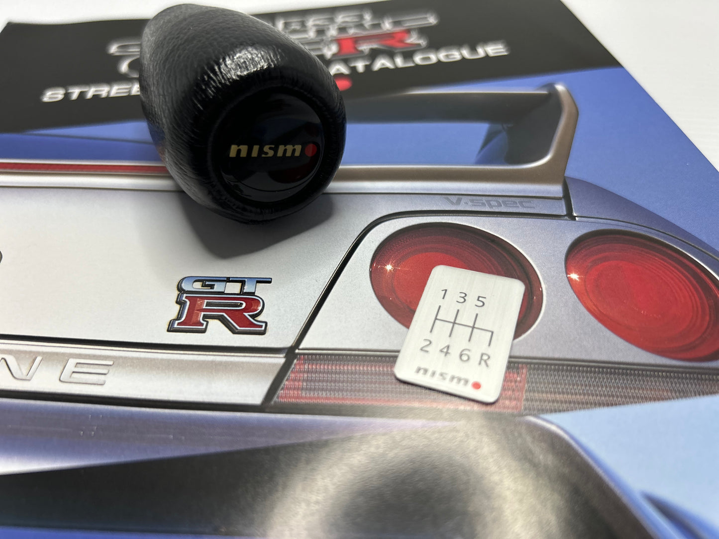 Nismo Mid Logo Shift Knob with shift Emblem - Black / Leather