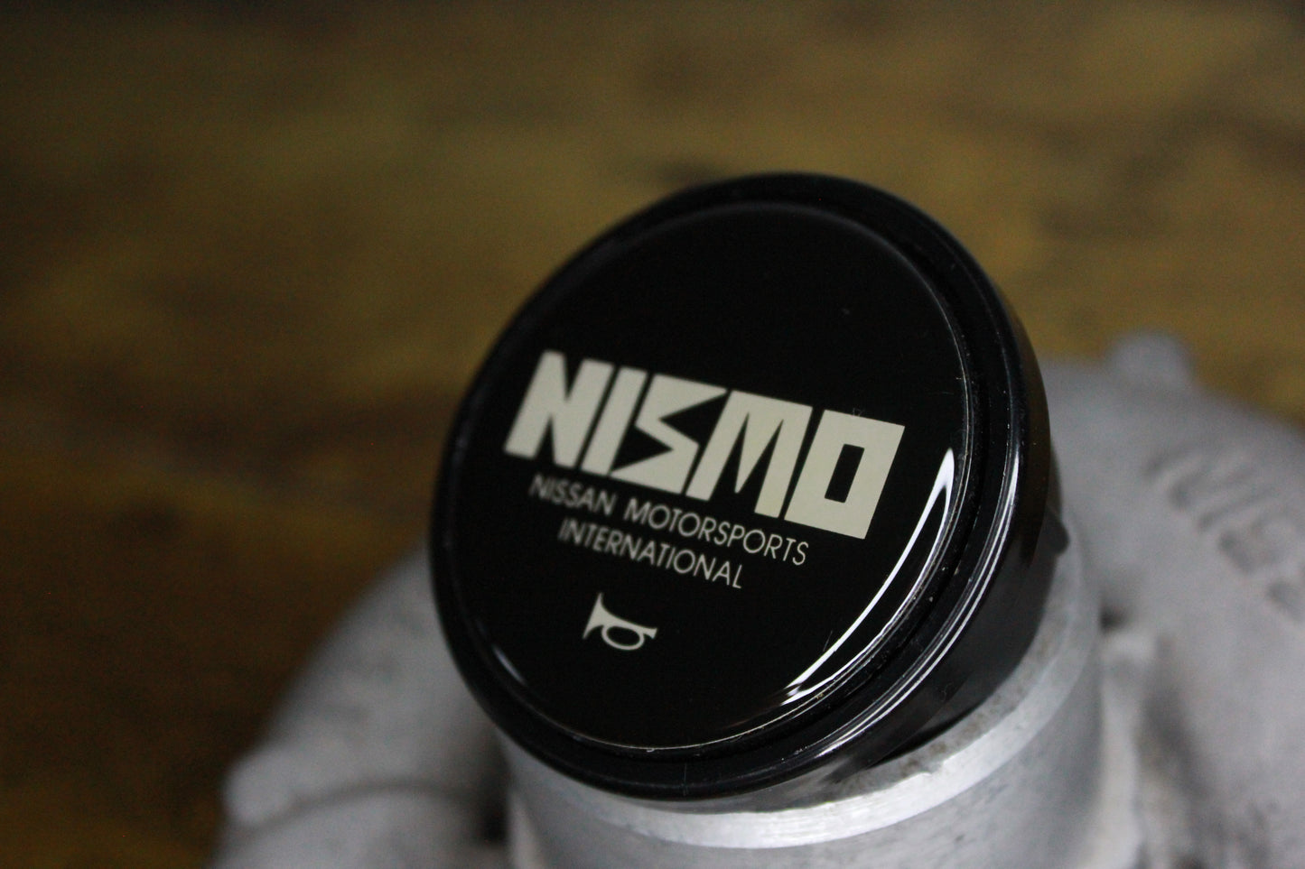 Genuine Nismo Old Logo Horn Button - Black