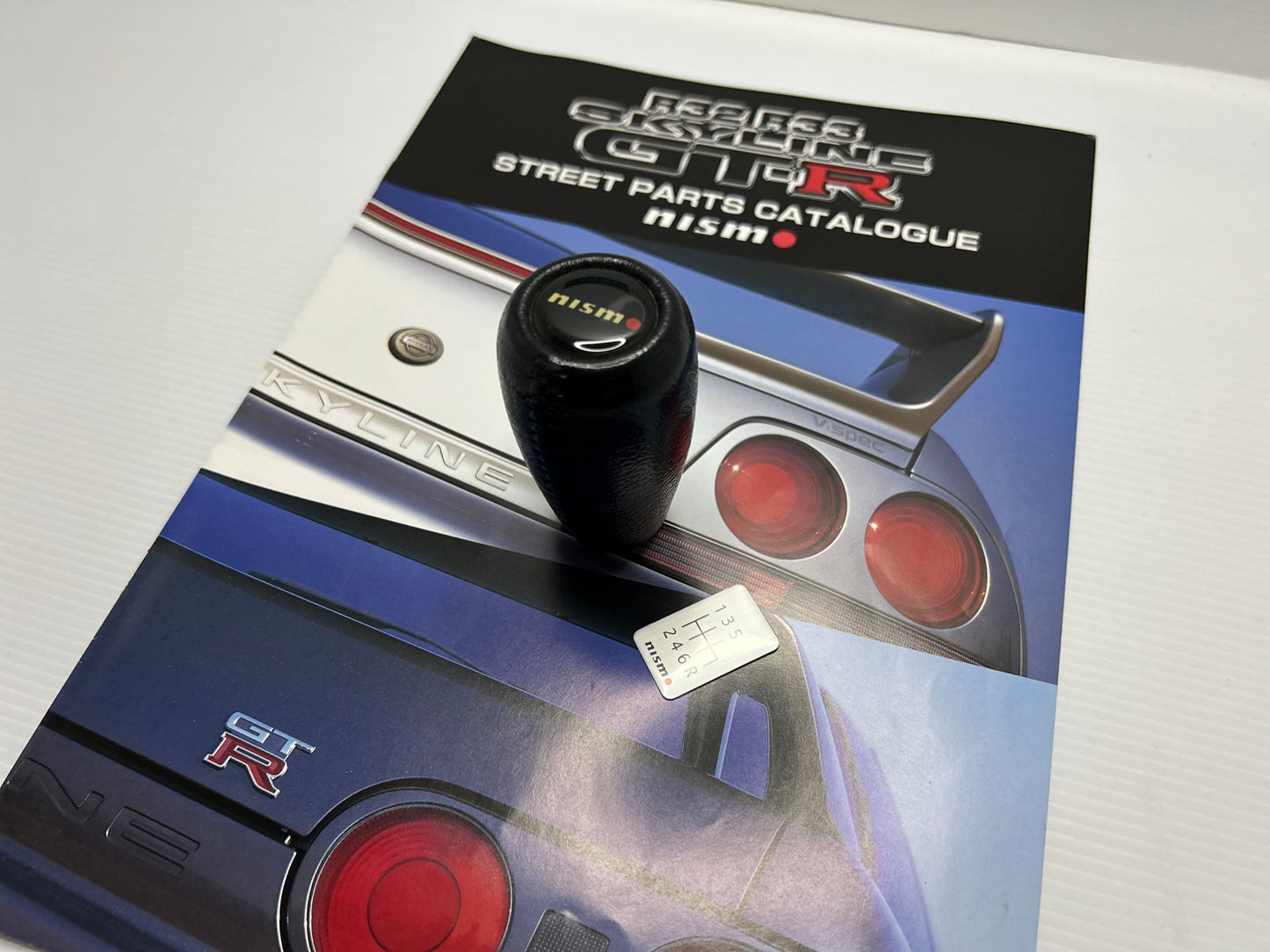 Nismo Mid Logo Shift Knob with shift Emblem - Black / Leather