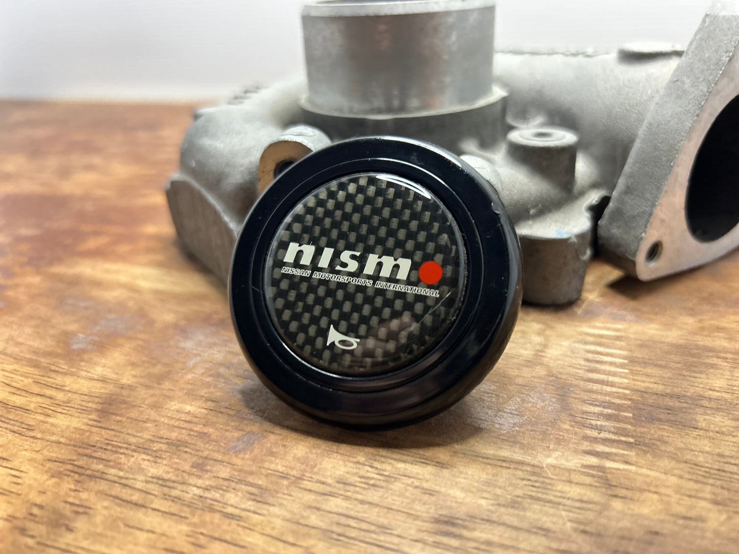 Genuine Nismo Mid Logo Horn Button - Carbon