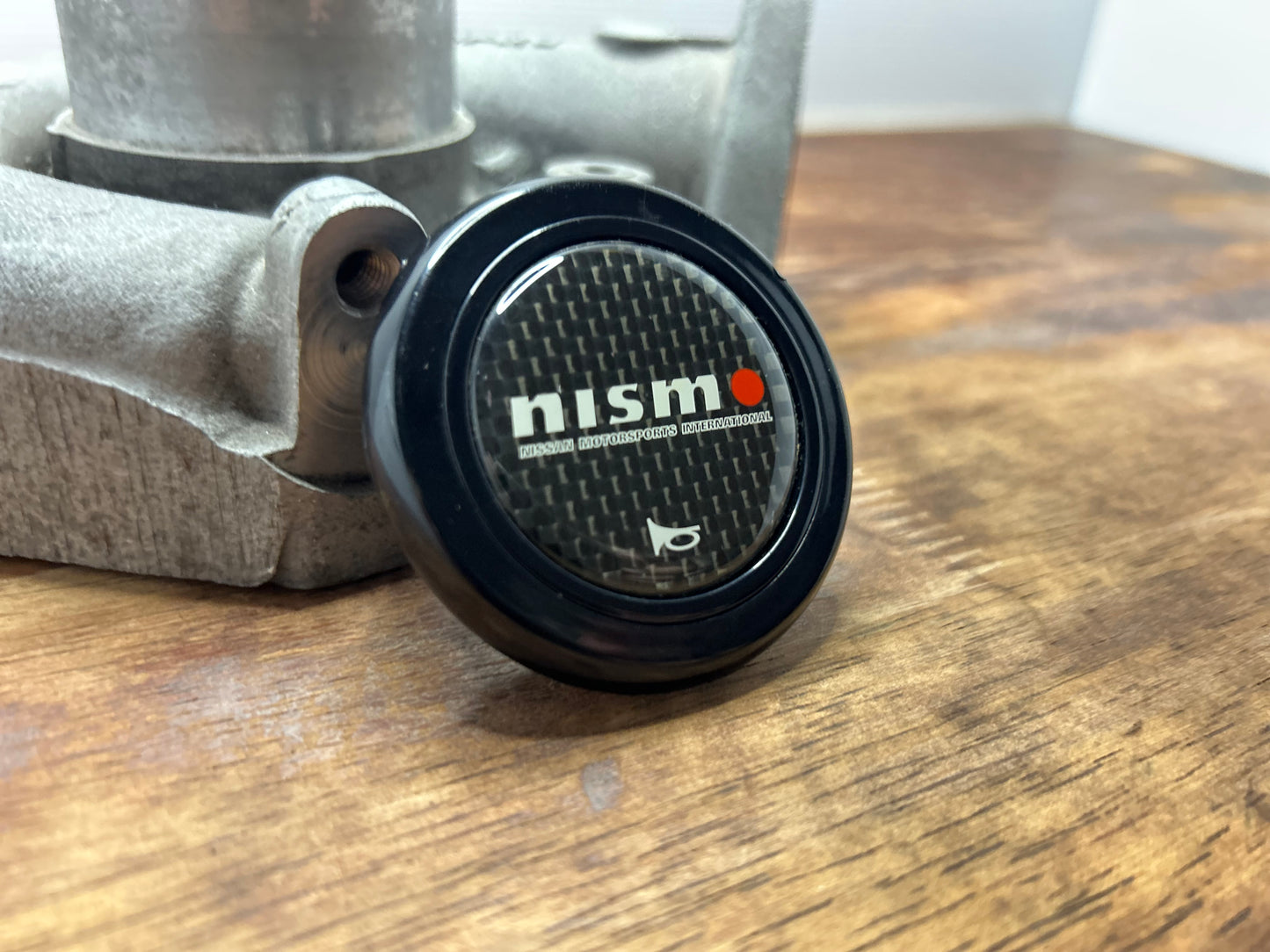 Genuine Nismo Mid Logo Horn Button - Carbon